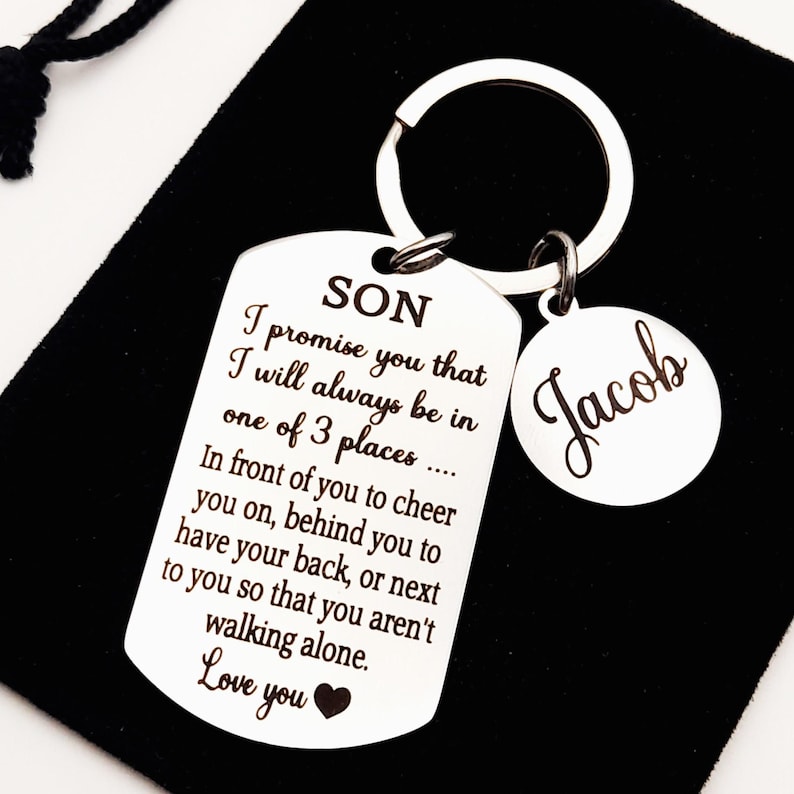 May include: Silver keychain with a tag that reads "SON I promise you that I will always be in one of 3 places... In front of you to cheer you on, behind you to have your back, or next to you so that you aren't walking alone. Love you" and a smaller tag that reads "Jacob".