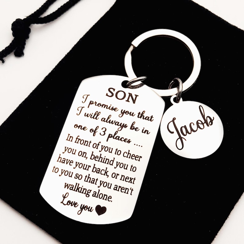 May include: Silver keychain with a dog tag that reads "SON I promise you that I will always be in one of 3 places... In front of you to cheer you on, behind you to have your back, or next to you so that you aren't walking alone. Love you" and a smaller tag that reads "Jacob".