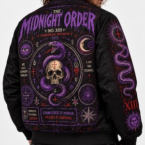 May include: A black bomber jacket featuring a large purple and white graphic on the back. The design includes a skull, a coiled snake, occult symbols, and text reading THE MIDNIGHT ORDER, NO. XIII, EUROPEAN DIVISION 1971, WE ALL BETWEEN WORLDS, I AM THE TUNNEL, KNOWLEDGE IS POWER, SILENCE IS SURVIVAL, MEMENTO PVLVERIS 13/666, and XIII.