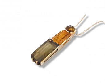 Pendant made of 750 yellow gold and 925 silver with tourmalines and amber