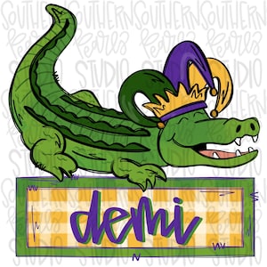 May include: A green alligator wearing a purple and gold jester hat with a gold crown. The alligator is smiling and has its mouth open. The alligator is sitting on a green and yellow checkered background with the word "demi" written in purple letters.