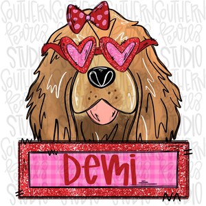 May include: A brown and white dog with a red bow and heart-shaped sunglasses is holding a red glitter sign with the name "Demi" written in white.