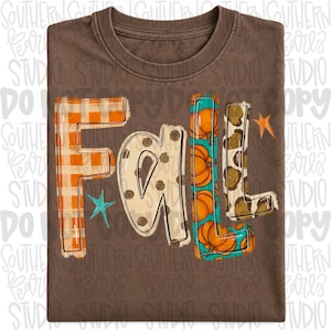 May include: A brown t-shirt featuring the word FALL in large letters. The F is orange plaid, the A is beige with brown polka dots, the L is teal with orange pumpkins, and the second L is leopard print. A small teal star and orange star are included.