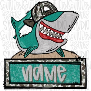 May include: A cartoon shark illustration wearing a camouflage hat and smiling widely, revealing sharp teeth. The shark is teal and gray, with a red mouth. Below the shark is a rectangular sign with the word "NAME" in white letters on a teal background.