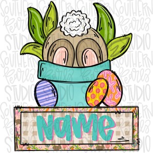 Puede incluir: Una ilustración de dibujos animados de un conejo color canela con una cola blanca esponjosa dentro de una maceta color verde azulado, rodeado de hojas verdes y dos huevos de Pascua estampados. Debajo hay un letrero con la palabra Name en verde.