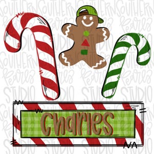 May include: A red and white candy cane, a green and white candy cane, a gingerbread man wearing a green hat, and a red and white striped sign with the word "Charles" in brown letters on a green and white checkered background.