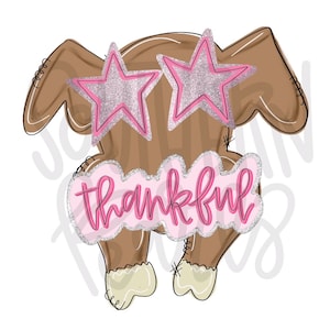 May include: A brown turkey illustration featuring pink glitter star-shaped glasses and a pink cloud-shaped sign with a silver glitter border that displays the word thankful in a cursive pink font, with light cream-colored feet at the bottom.