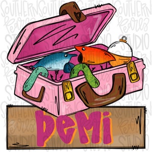 May include: A pink tackle box with a brown handle and gold accents. The box is open and contains fishing lures, including a blue lure, a red lure, and a green worm. The box is sitting on a wooden sign with the word "Demi" written in pink letters.