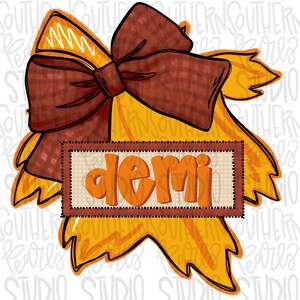 May include: A fall-themed personalized door hanger with a large brown bow and a yellow leaf design. The name "demi" is written in orange letters on a brown burlap background.