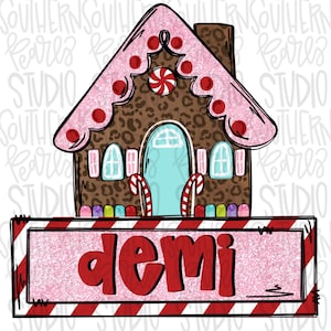 May include: A pink and brown gingerbread house with candy cane accents and a sign that reads "demi".