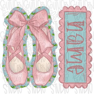 May include: A pair of light pink ballet slippers with long ribbons tied in a bow, set against a light blue background with a repeating green and pink floral pattern, alongside a scalloped rectangular tag featuring the name Alayna in pink.