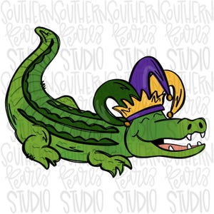 May include: A cartoon illustration of a green alligator wearing a purple and gold jester hat and a gold crown. The alligator is smiling with its mouth open, revealing teeth. The image has the text "SOUTHERN PEARLS STUDIO" in the background.