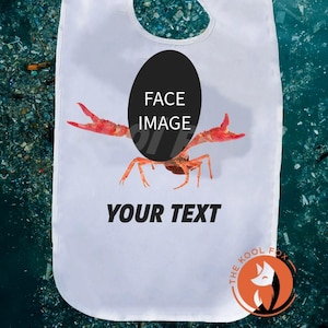 May include: White baby bib featuring a red and orange crab design. The bib includes the text "YOUR TEXT" and "FACE IMAGE". The Kool Fox logo is visible in the bottom right corner.
