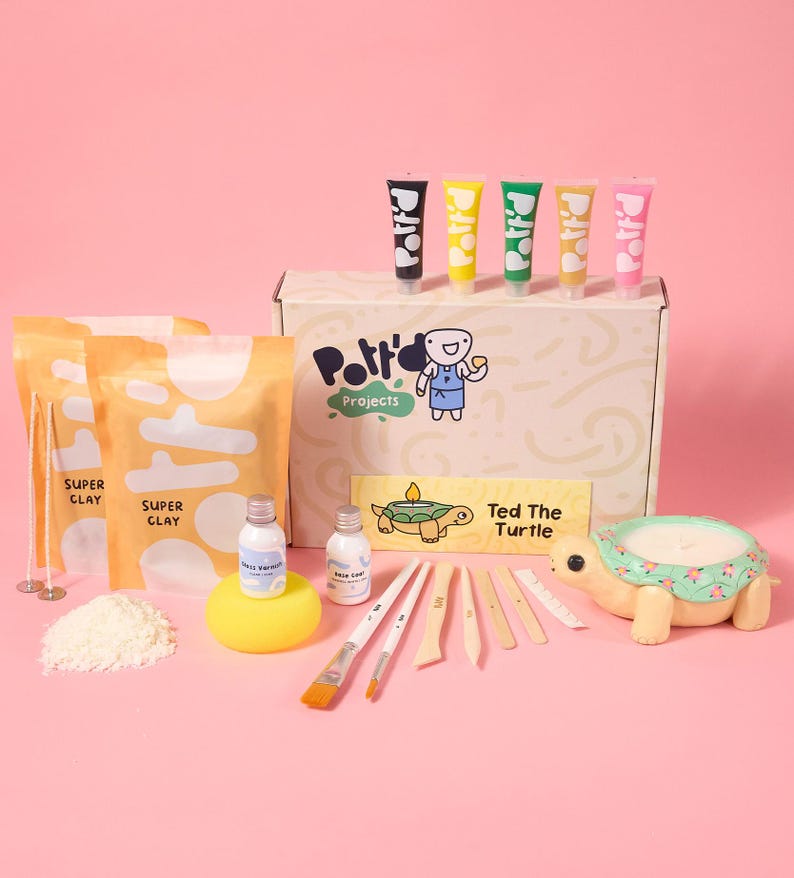 May include: A craft kit for making a turtle candle. The kit includes white clay, paint, tools, and a turtle-shaped candle mold. The box says "Pottery Projects" and "Ted the Turtle".