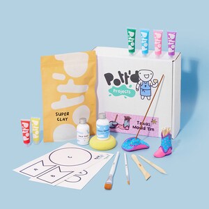 May include: A craft kit for making clay boots. The kit includes a bag of clay, paint, brushes, and a small boot mold. The box is labeled "Polft'd Projects" and "Texas Mould 'Em".