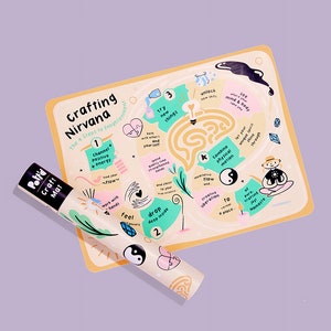 May include: A yellow and orange illustrated crafting mat with a maze design and the text "Crafting Nirvana: The 4 Steps to Enlightenment". The mat features a black and white yin yang symbol, a heart, and a light blue bottle.