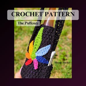 May include: A black crochet bottle cozy featuring a multi-colored leaf applique in shades of green, yellow, orange, red, pink, blue, and light blue. The text CROCHET PATTERN, The Puffcozy, and Heady Hooks are visible on the image.