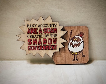 エッグボーイが「めちゃくちゃだ！」と言っている手描きの冷蔵庫用マグネット（ハズビン・ホテル シーズン 1 エピソード 7 にインスパイアされた）