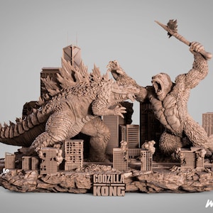 Peut inclure: Sculpture en résine marron représentant Godzilla et King Kong en pleine bataille, sur fond de bâtiments miniatures. La sculpture mesure 70 cm de haut et porte l'inscription "Godzilla vs Kong".