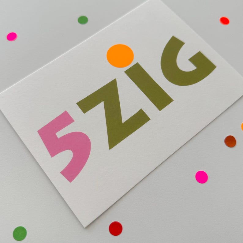 May include: A white card with the text "5 ZIG" in pink, green, and orange letters. The card is surrounded by colorful dots.