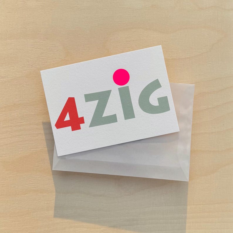 May include: A white card with the text "4ZIG" in gray letters and a pink circle above the text. The card is in a clear plastic envelope.