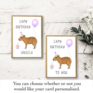 May include: Two greeting cards with a capybara wearing a party hat and holding a cupcake. The text on the cards reads "CAPY BIRTHDAY" and "TO YOU".