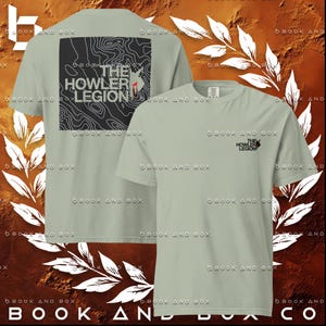 May include: Sage green t-shirts with the text "THE HOWLER LEGION". One shirt has a black square graphic with a topographic map design and the text "THE HOWLER LEGION". The other shirt has the text "THE HOWLER LEGION" on the front.
