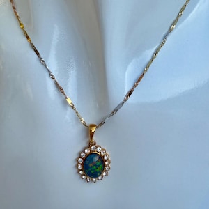 A Multicolour 18k Gold Necklace with An Australian Oval Black Opal Pendant in Gold Plated Silver Setting