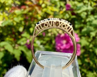 A UK Hallmarked Vintage Diamond and Sapphire 9ct Gold Ring with "I LOVE YOU" along the Gallery
