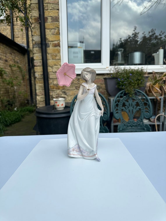 A Boxed Signed Lladro 7636 Afternoon Promenade Porcelain Figurine