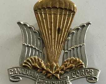 Insignia de gorra del Cuerpo de Paracaidistas canadiense de la Segunda Guerra Mundial.