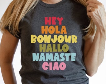 Hey Hola Bonjour Hallo Namaste Ciao Greetings Tee Spanish Teacher Shirt Bilingual Teacher Dual Language Instruction Teacher Tee