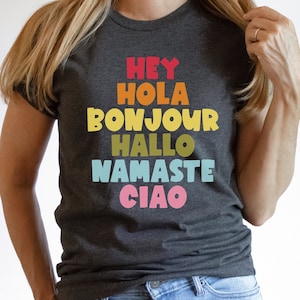 Hey Hola Bonjour Hallo Namaste Ciao Greetings Tee Spanish Teacher Shirt Bilingual Teacher Dual Language Instruction Teacher Tee