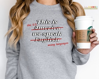 This is America we speak English Corrected Patriotic Red White and Blue Spanish Teacher Bilingual Teacher Dual Language Crewneck Sweatshirt