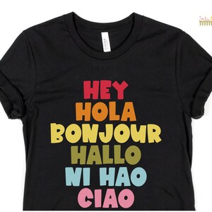 Hey Hola Bonjour Hallo Ni Hao Ciao Retro Greetings Tee Spanish Teacher Shirt Bilingual Teacher Dual Language Instruction Teacher Tee Black