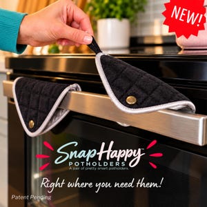 May include: A pair of black quilted fabric potholders with silver trim and a gold-tone snap button closure. The potholders are draped over a stainless steel oven handle. Text on the image reads SnapHappy POTHOLDERS, Right where you need them!