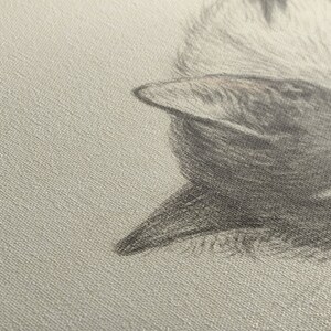 May include: A close-up of a gray and white textured fabric with a black and gray bird design. The bird's beak is pointed and its feathers are detailed.
