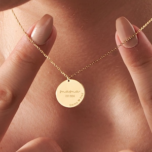 May include: Gold necklace with a round pendant that says "mama est 2024 Emma Fred" on it.