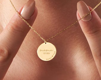 May include: Gold necklace with a round pendant that says "mama est 2024 Emma Fred" on it.