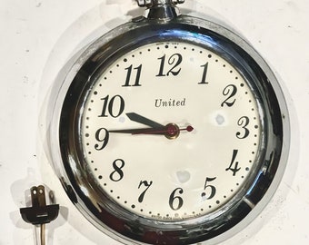 Reloj de bolsillo vintage United Clock Corp. en funcionamiento, modelo n.° 370
