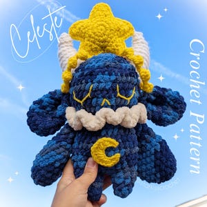 May include: A crocheted blue and yellow plush toy with a star on its head and a crescent moon on its belly. The toy is named Celeste and is a crochet pattern.