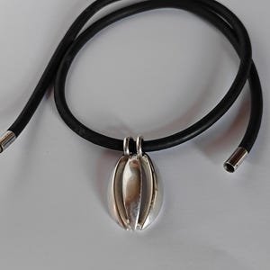 Georg Jensen sterling silver pendant #427 with original cord .