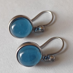 Julie Sandlau sterling silver earrings with blue stone.