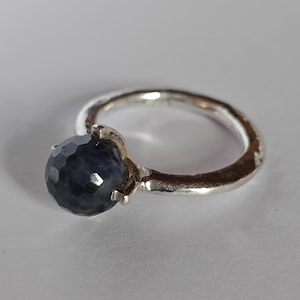 Dirk sterling silver ring with blue stone.