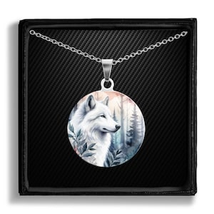 May include: A silver necklace with a round pendant featuring a watercolor painting of a white wolf in a forest setting. The pendant is surrounded by a silver chain.