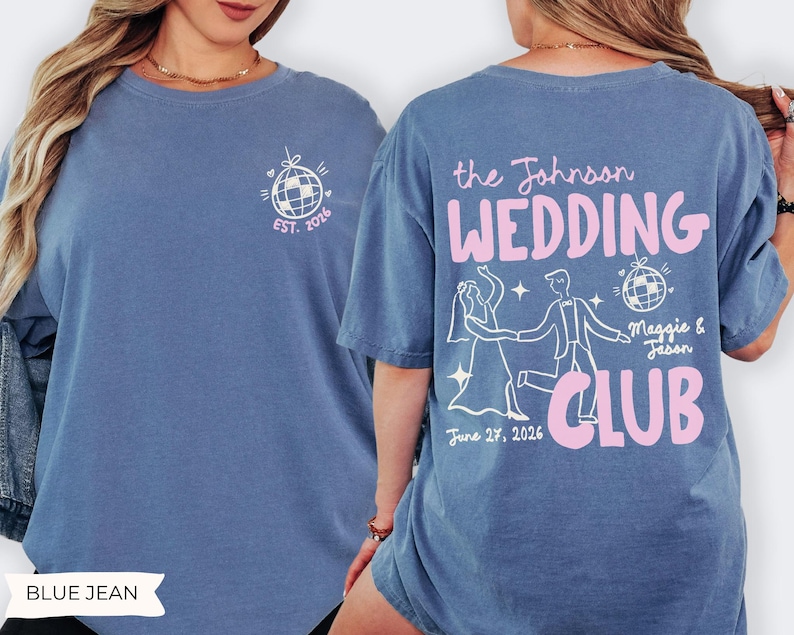 May include: Blue jean-colored t-shirt with a white and pink graphic design. The front features a disco ball design with "EST. 2026". The back displays "the Johnson WEDDING CLUB" with a dancing couple illustration, date, and names.