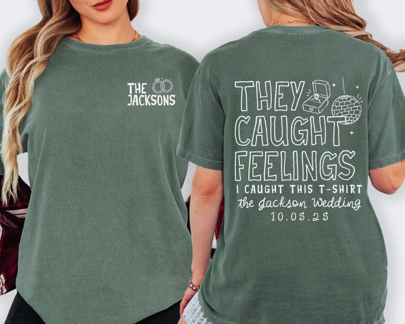 May include: A green t-shirt with white text that reads "THE JACKSONS" and two wedding rings on the front. The back of the shirt says "THEY CAUGHT FEELINGS" with a ring box and disco ball graphic. It also includes "I CAUGHT THIS T-SHIRT the Jackson Wedding 10.05.25".
