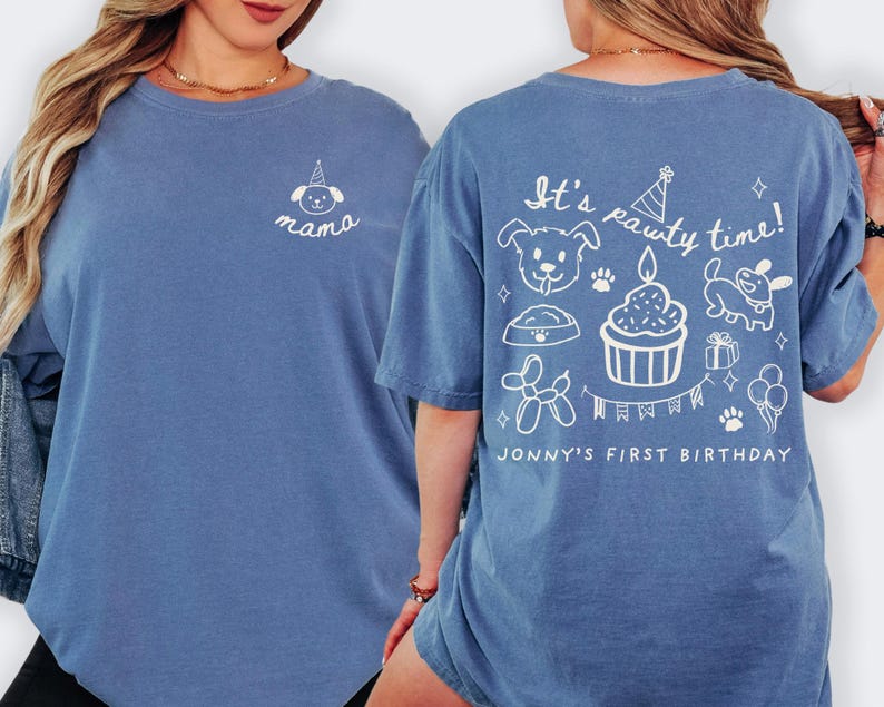 May include: Blue long-sleeve shirt with white graphic designs. The front features a dog illustration and the word "mama". The back has the text "It's pawty time!" with dog-themed illustrations and "Jonny's First Birthday".