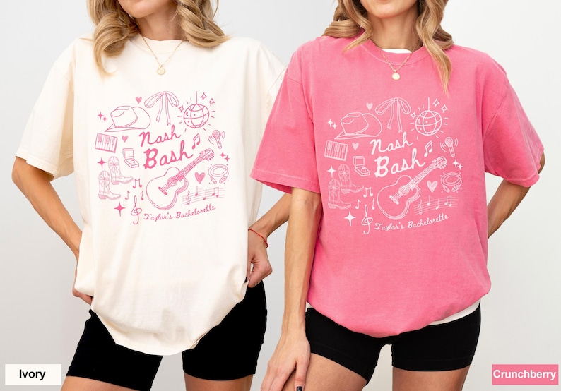 May include: Two t-shirts with a pink graphic design featuring a guitar, cowboy hat, and the text "Nash Bash" and "Taylor's Bachelorette". The t-shirt on the left is ivory and the t-shirt on the right is pink.