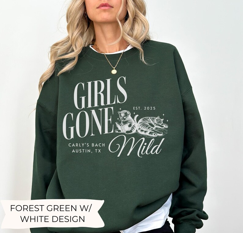 May include: Forest green sweatshirt with a white design that says "Girls Gone Mild" with a cat illustration and the text "Carly's Bach Austin, TX Est. 2025".